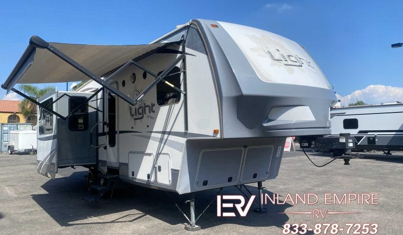 Used 2017 Highland Ridge Open Range Light LF297RLS 5th wheel RV parked at Inland Empire RV in Colton CA with awning extended